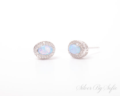 Light blue opal oval shaped sterling silver earrings