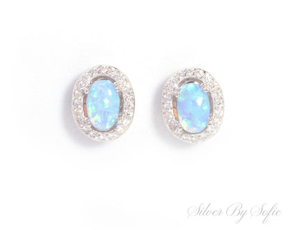 Light blue opal oval shaped sterling silver earrings