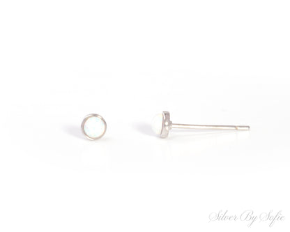 Small circular white opal sterling silver stud earrings